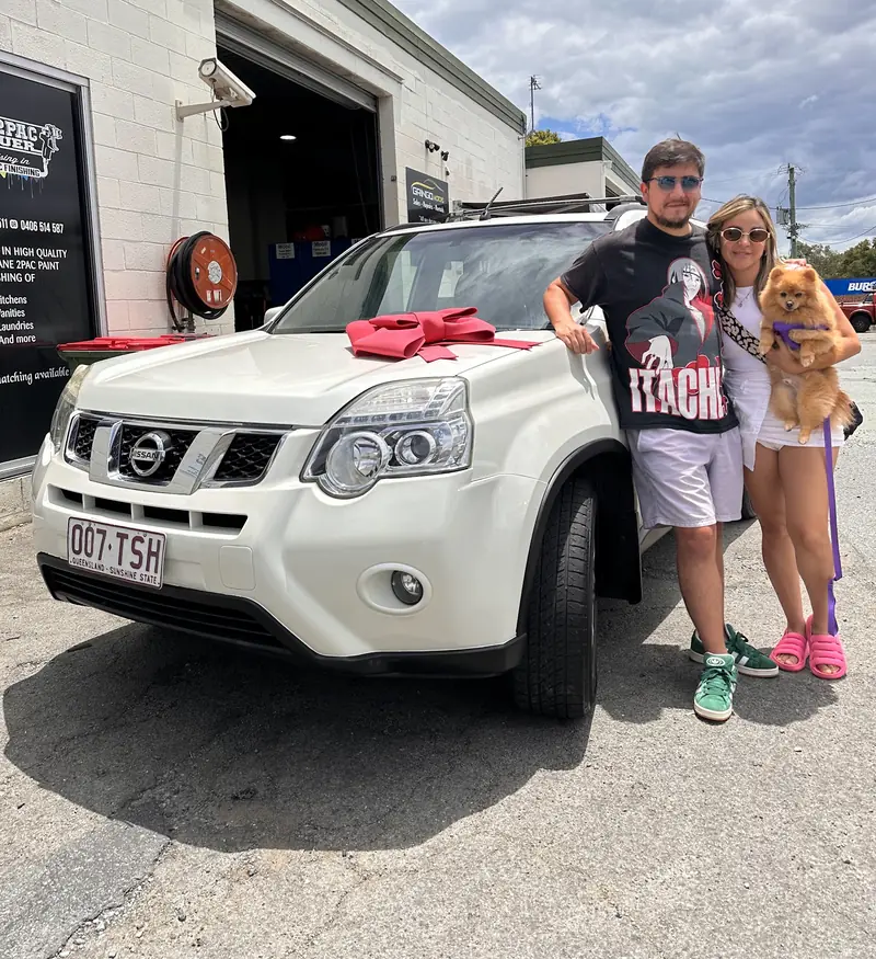 Happy customers collecting their car from Gringo Motors